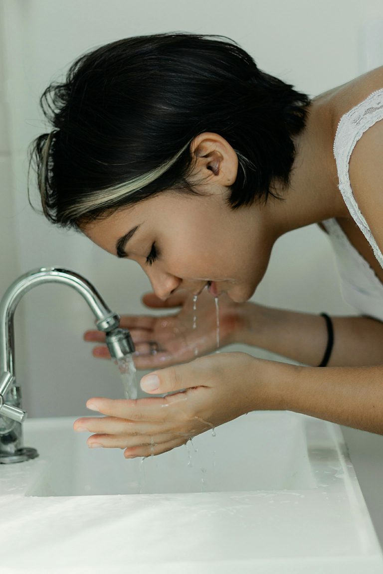 Photo by Vitória Santos: https://www.pexels.com/photo/woman-washing-her-face-with-water-2087954/